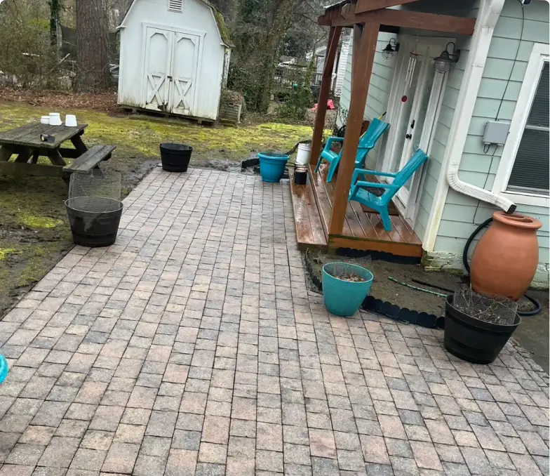 Paver patio cleaned of moss and grime